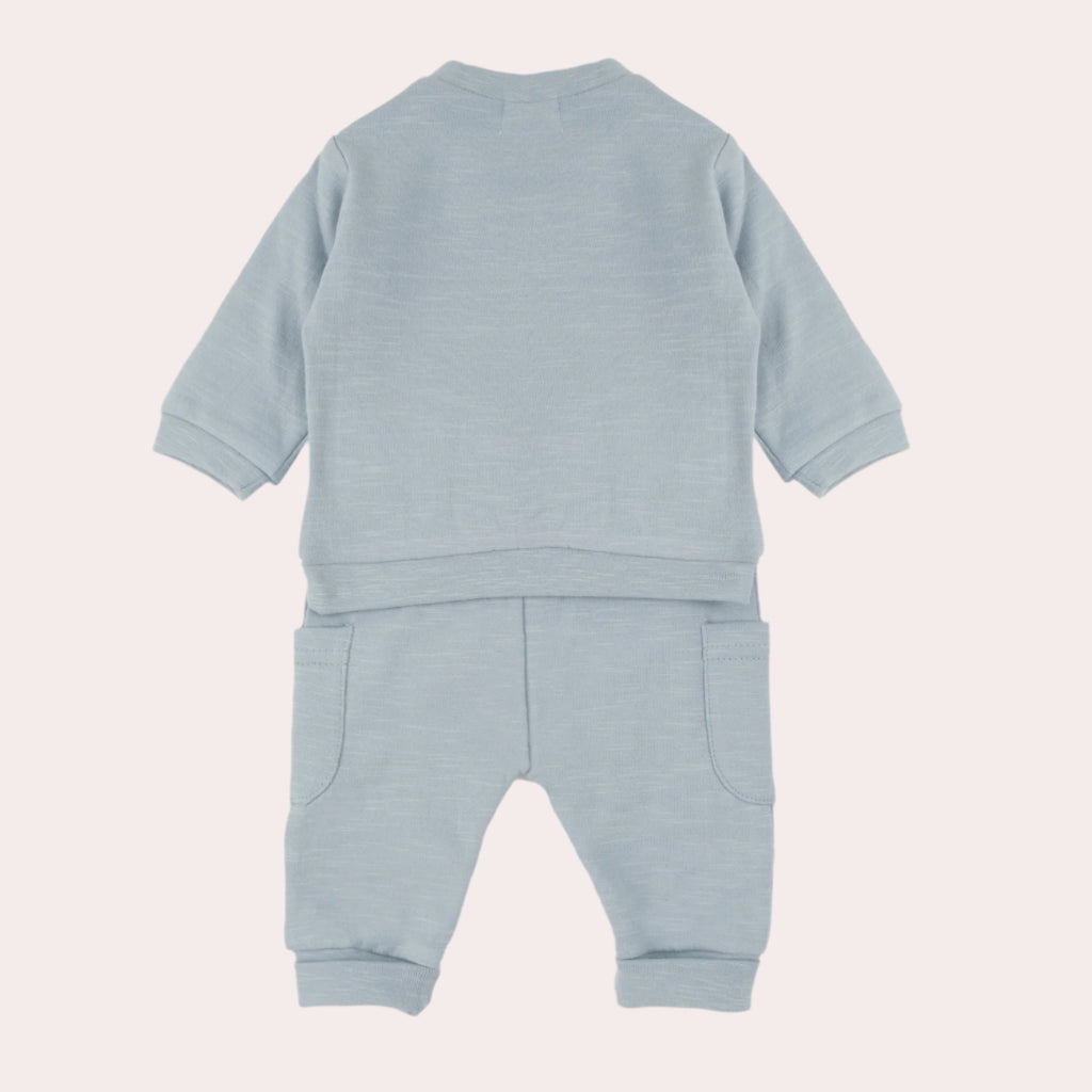 back view of light blue baby tracksuit on a white background