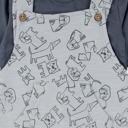 Baby romper patterned overalls and blue long-sleeve shirt close up