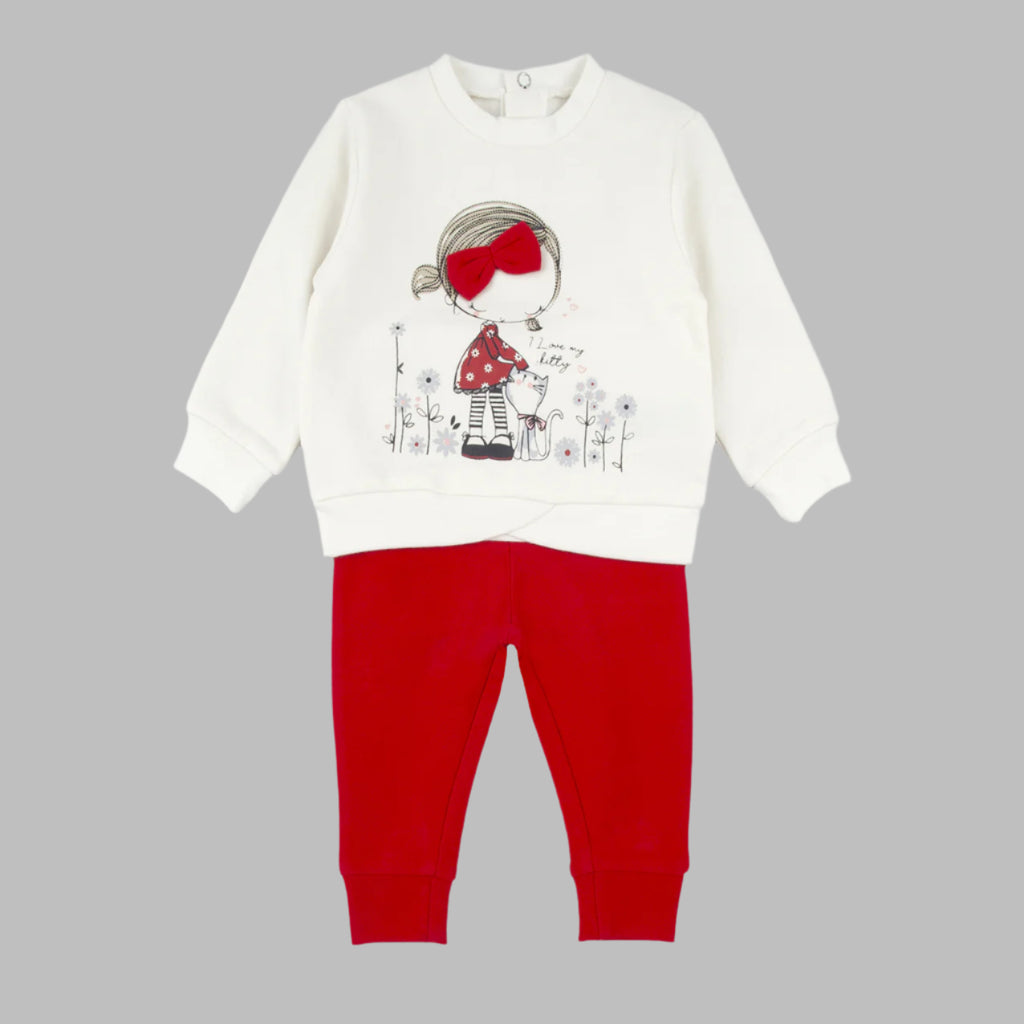 Children's outfit with white long-sleeve top and red pants on a white background