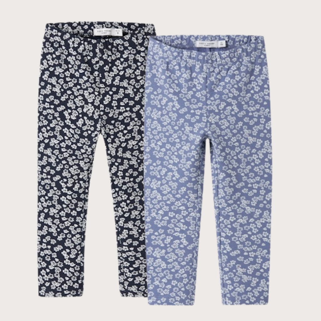 Two pairs of floral leggings, one navy and one blue, on a light  background.