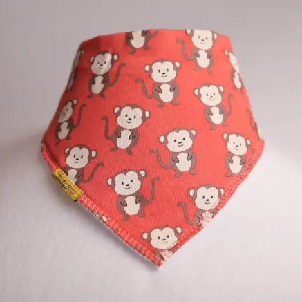 Red bandana with monkey pattern on a gray background