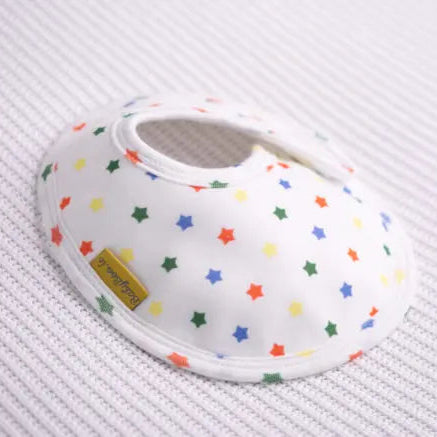 Baby bib with colorful star pattern on a white background
