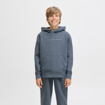 Child wearing a grey hoodie with jack and jones branding on a white background