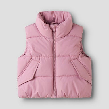 Pink puffer vest on a light  background