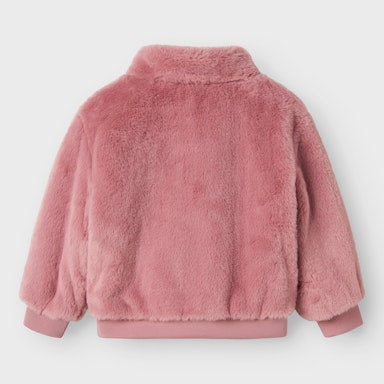 Pink fluffy jacket on a light  background