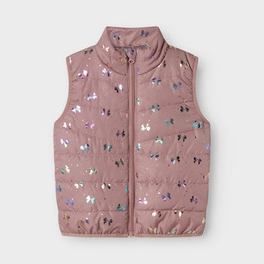 Pink puffer vest with bow pattern on a white background