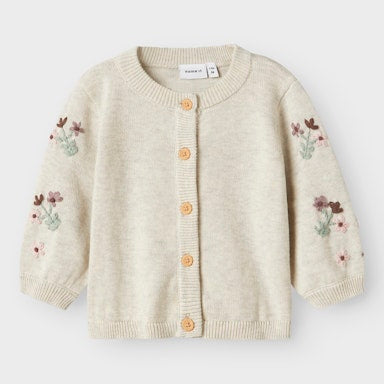 Beige cardigan with floral embroidery on a white background