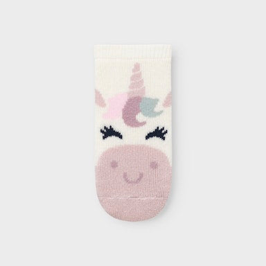 Unicorn-themed sock on a light graybackground