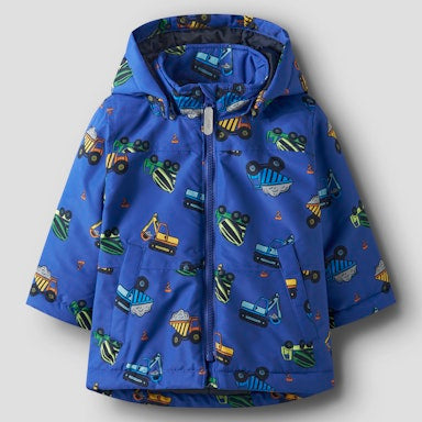 Blue children's jacket with vehicle pattern on a grey background