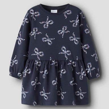 Navy dress with bow pattern on a light  background