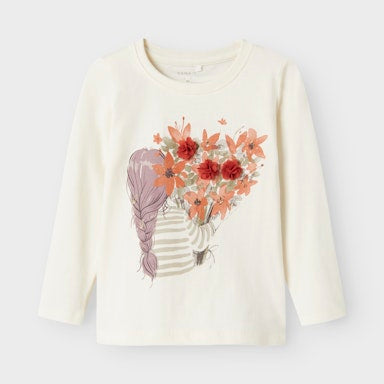 White long-sleeve shirt with floral design and girl holding flowers illustration on a light  background