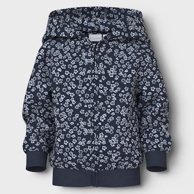 Navy blue sweatshirt with small white floral pattern on a light  background