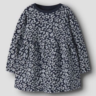Navy blue dress with white floral pattern on a light  background