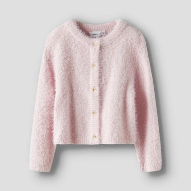 Pink textured cardigan on a light  background
