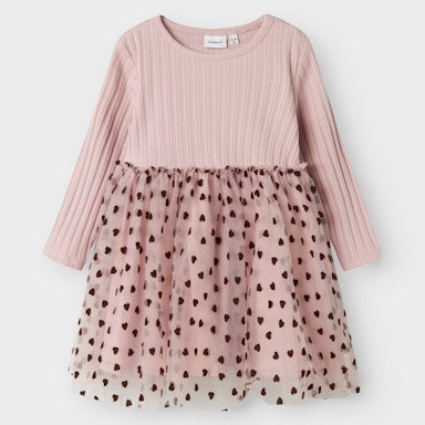 Pink dress with a sheer bottom layer featuring black heart patterns on a white background