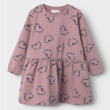 Pink dress with heart pattern on a light  background