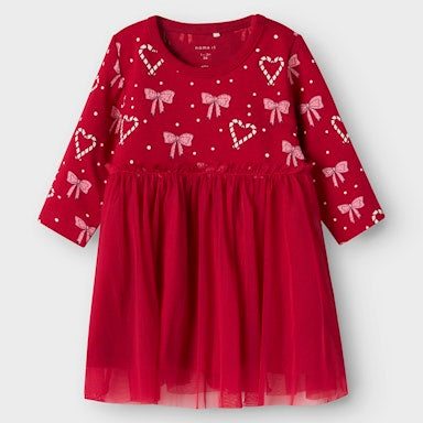 Red dress with heart and bow patterns on a light background