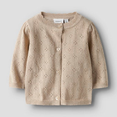 Beige knitted cardigan on a light  background