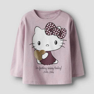 Pink long sleeve top with Hello Kitty graphic and text on a light  background