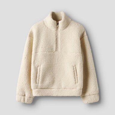 Beige fleece pullover on a light  background