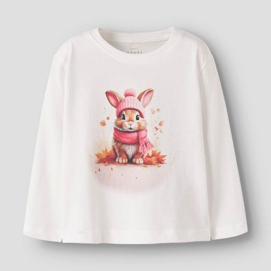 White shirt with a rabbit design wearing a pink hat and scarf on a light grey background