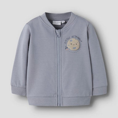 Baby's blue jacket with a cartoon moon design on a light grey background