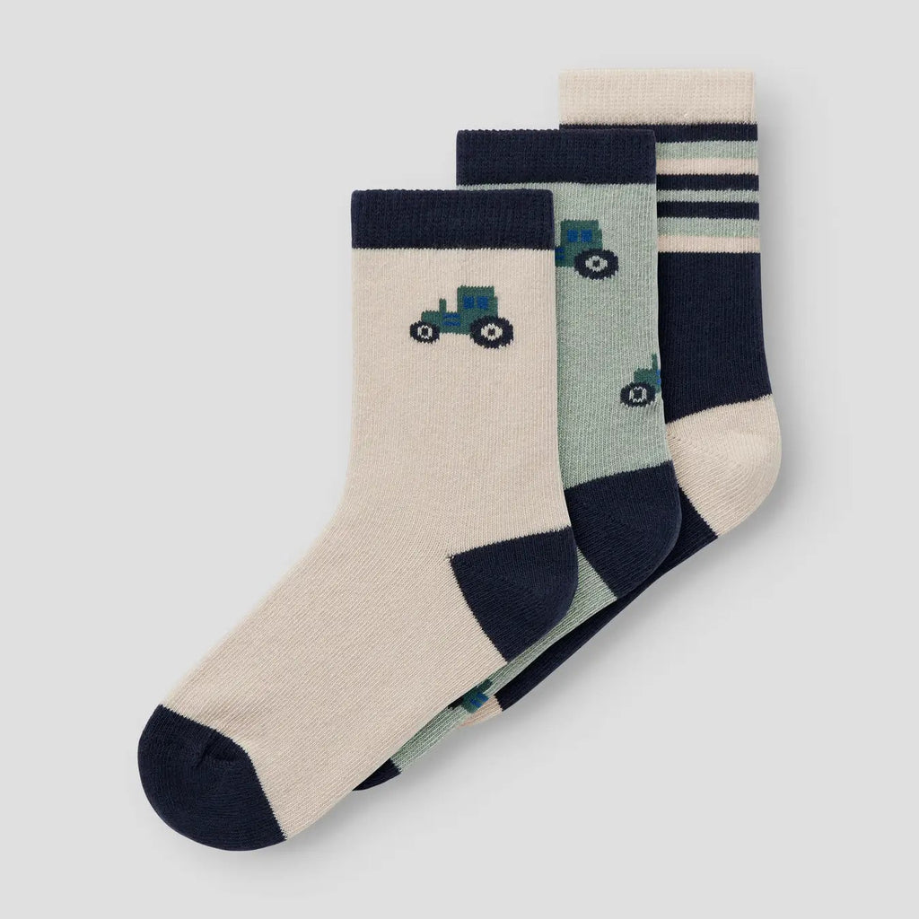 Set of three children's socks with tractor design on a light grey background