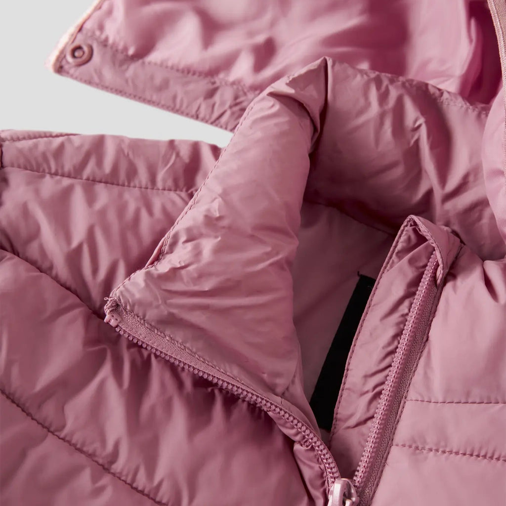 Close-up of a pink puffer jacket with a zipper on a light background